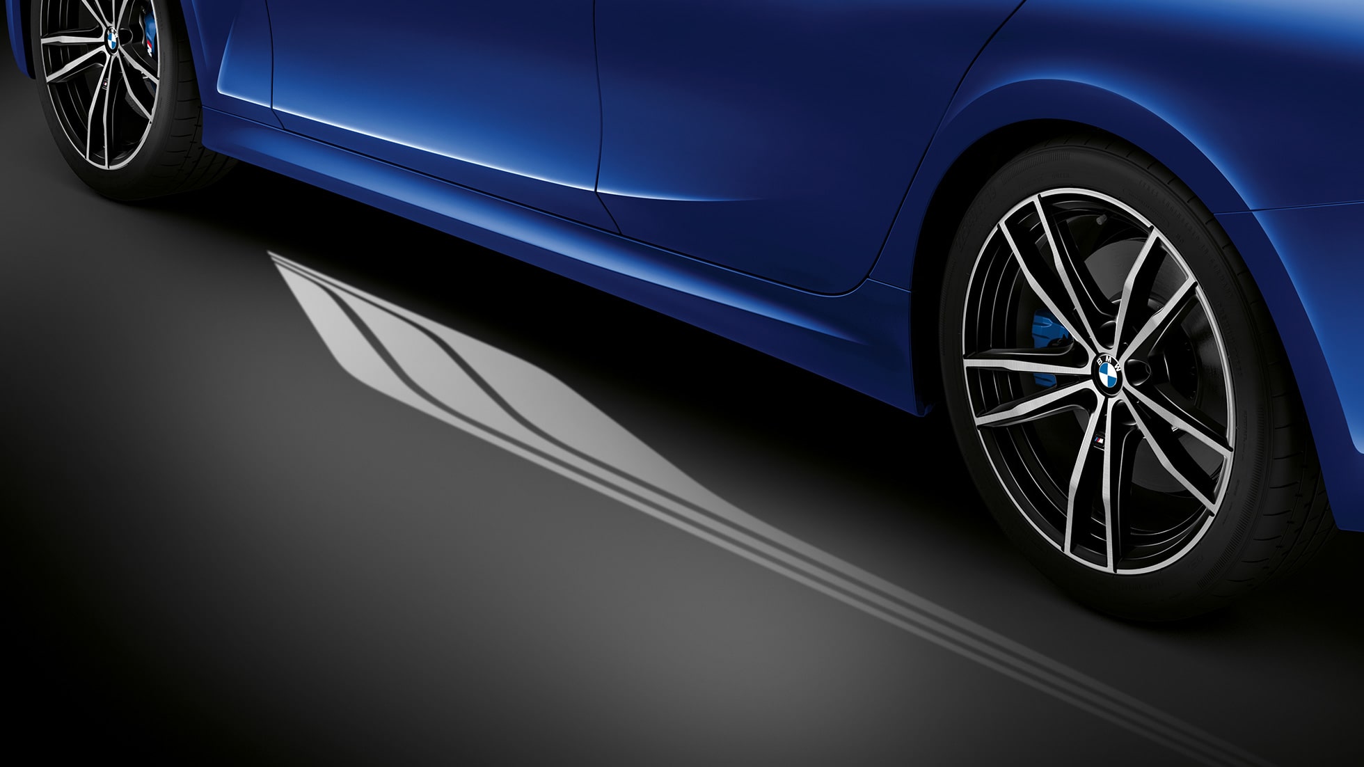 BMW 3 Series, Welcome Light Carpet. Detailed side view of the open driver's door with Welcome Light Carpet.